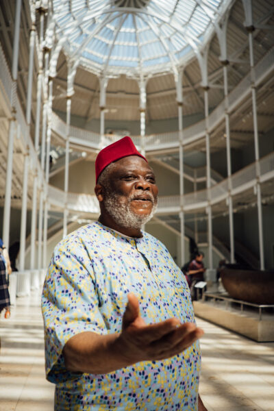 Master storyteller chief Gift Amu in the National Museum of Scotland Grand Gallery