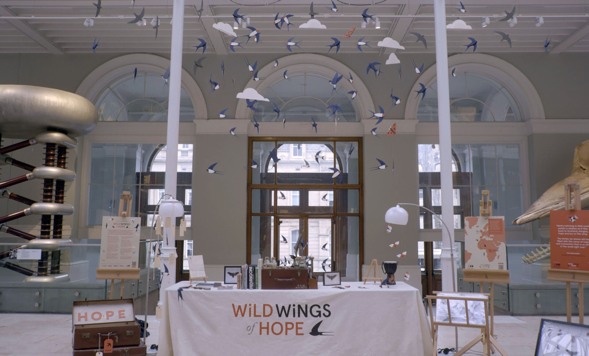 The Wild Wings of Hope welcome desk in the National Museum of Scotland Grand Gallery.