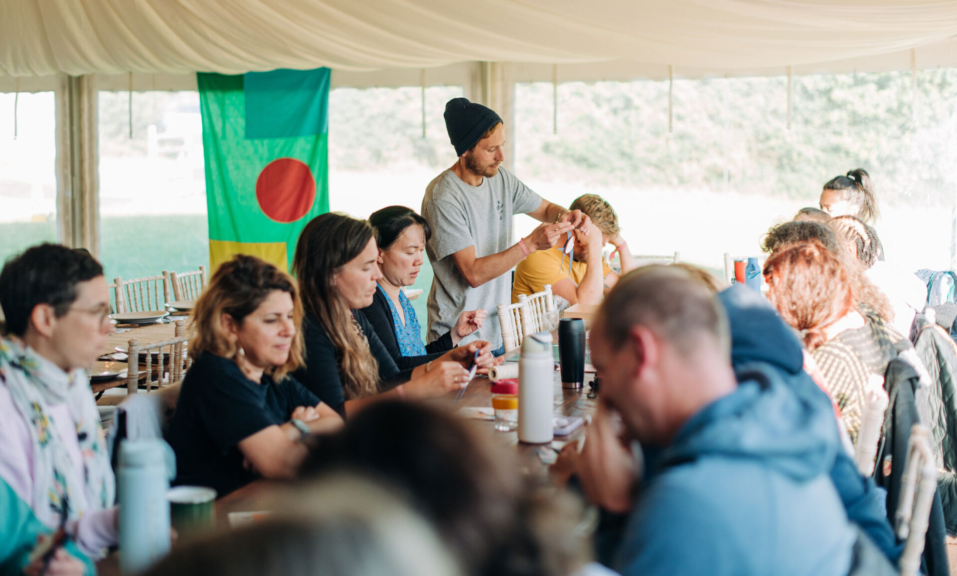 Artist Ed Harrison facilitates the crafting of barn swallows in a community workshop