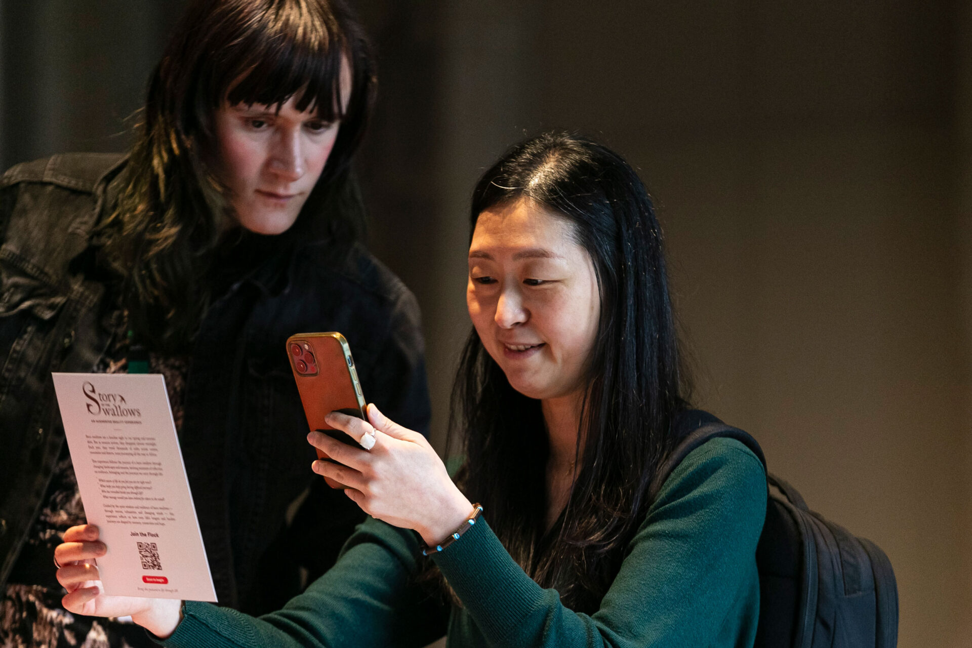 Developer Tanya Parker observes a participant testing the augmented-reality postcard experience at the Edinburgh Futures Institute.